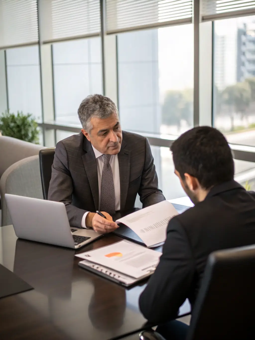 A compassionate ErbService team member consulting with a client in a Hamburg home, discussing estate planning options.
